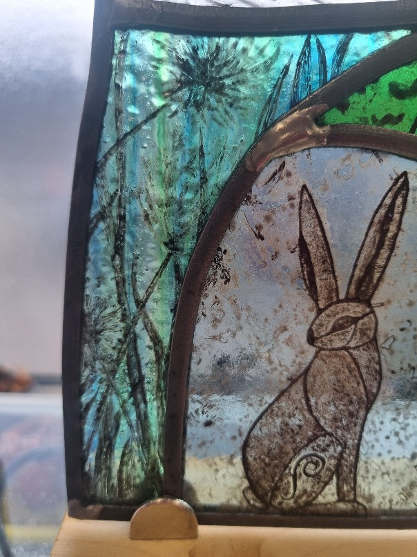 Stunning hare and moon stained glass panel.